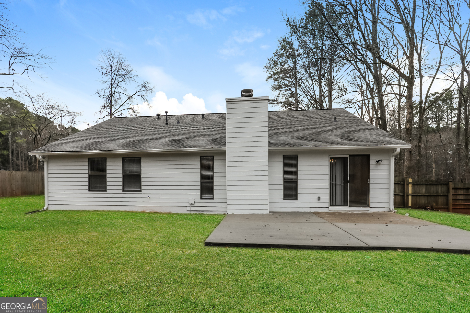 125 Whitney Way Fayetteville, GA 30214 - Photo 15 of 16 a front view of a house with a yard and large tree