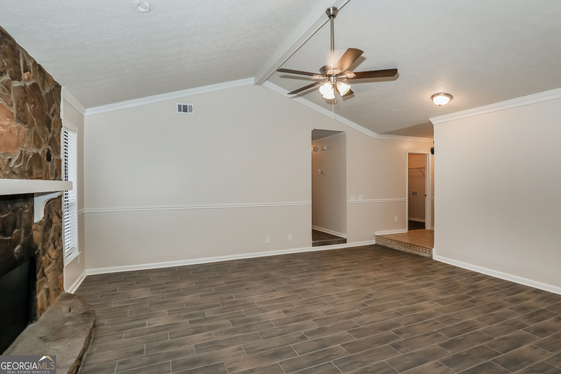 125 Whitney Way Fayetteville, GA 30214 - Photo 3 of 16 a view of empty room with wooden floor and fan