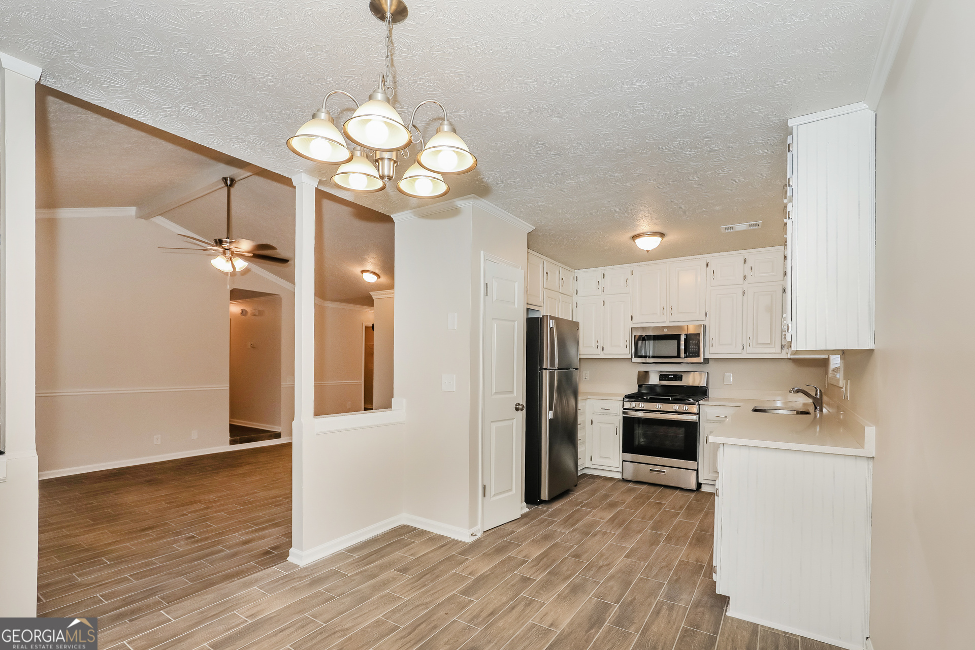125 Whitney Way Fayetteville, GA 30214 - Photo 5 of 16 a kitchen with stainless steel appliances a refrigerator oven a sink dishwasher and a refrigerator