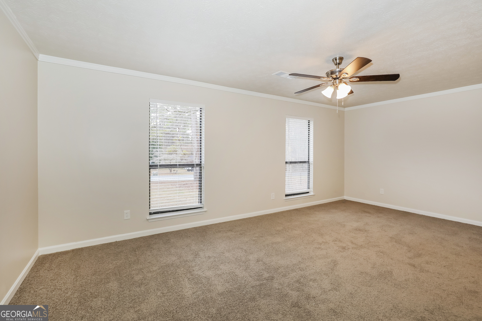 125 Whitney Way Fayetteville, GA 30214 - Photo 9 of 16 a view of an empty room with a window
