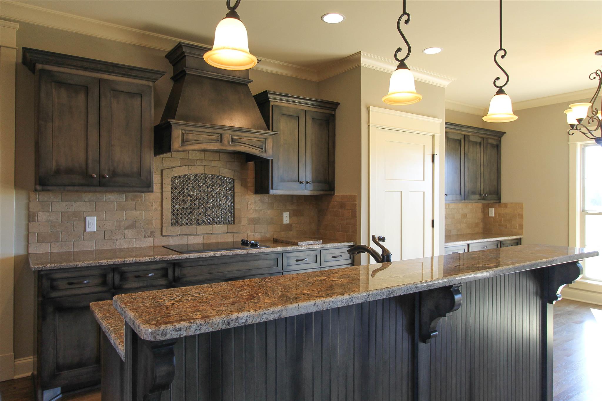 620 Academy Road, Unit 14 Lebanon, TN 37087 - Photo 10 of 24 a kitchen with stainless steel appliances granite countertop a sink a stove and a wooden cabinets