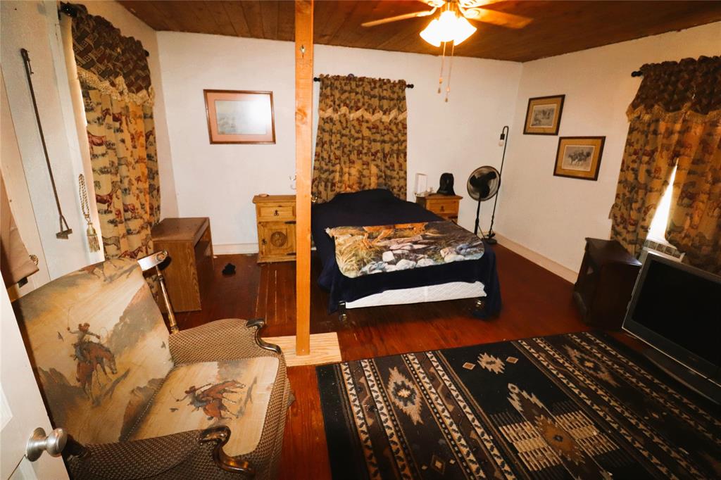 10543 Old Joy Shannon Road Henrietta, TX 76365 - Photo 15 of 36 a bedroom with furniture and a window