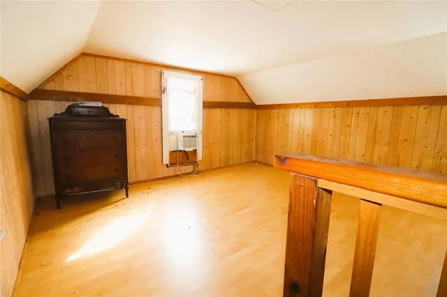a living room with furniture a chandelier and a flat screen tv