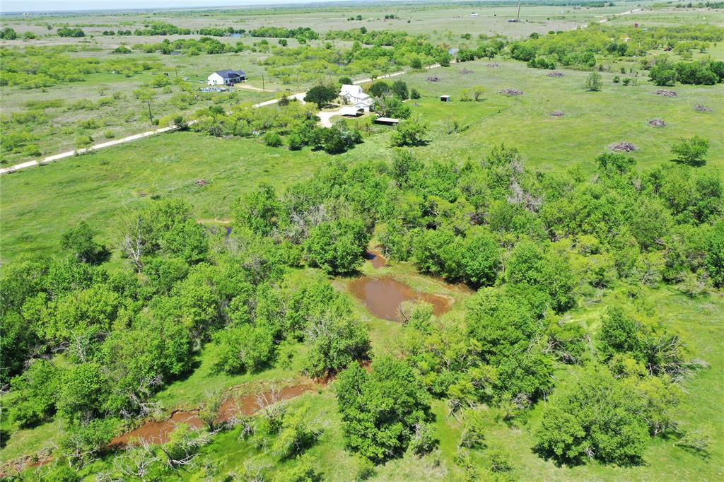 10543 Old Joy Shannon Road Henrietta, TX 76365 - Photo 3 of 36 a view of a garden with a lake