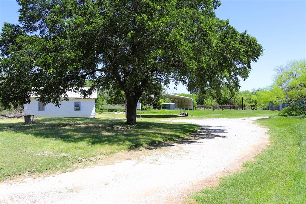 10543 Old Joy Shannon Road Henrietta, TX 76365 - Photo 6 of 36 a view of a house with a yard