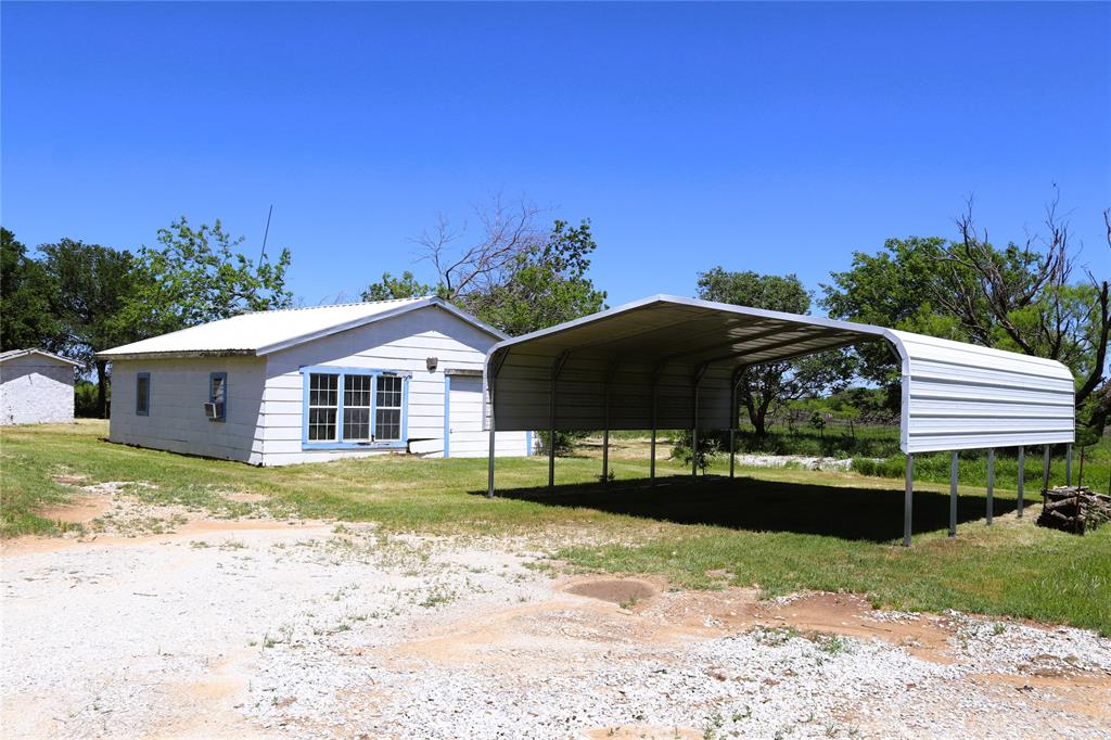 10543 Old Joy Shannon Road Henrietta, TX 76365 - Photo 7 of 36 a front view of a house with a yard
