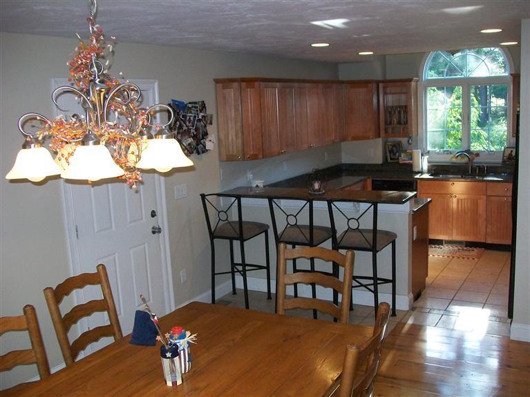 71 Meadowbrook Road Mashpee, MA 02649 - Photo 2 of 14 a view of a dining room with furniture window and wooden floor