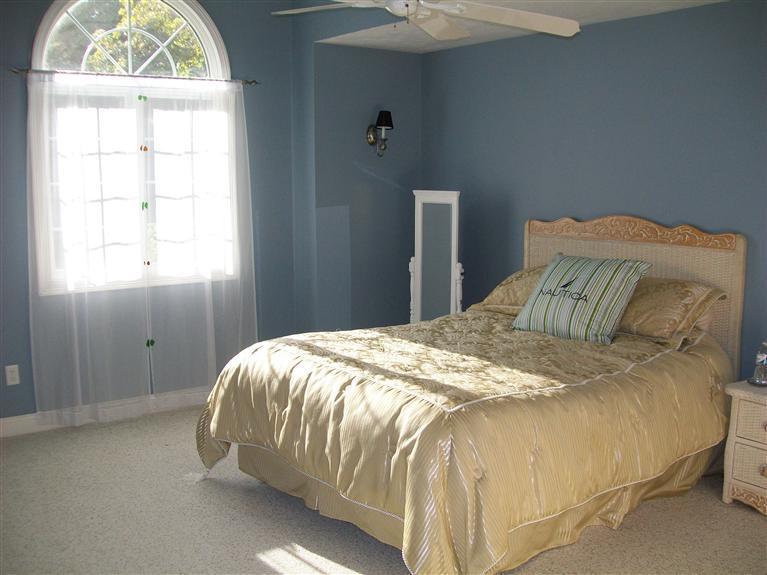 71 Meadowbrook Road Mashpee, MA 02649 - Photo 9 of 14 a bedroom with a bed and a window