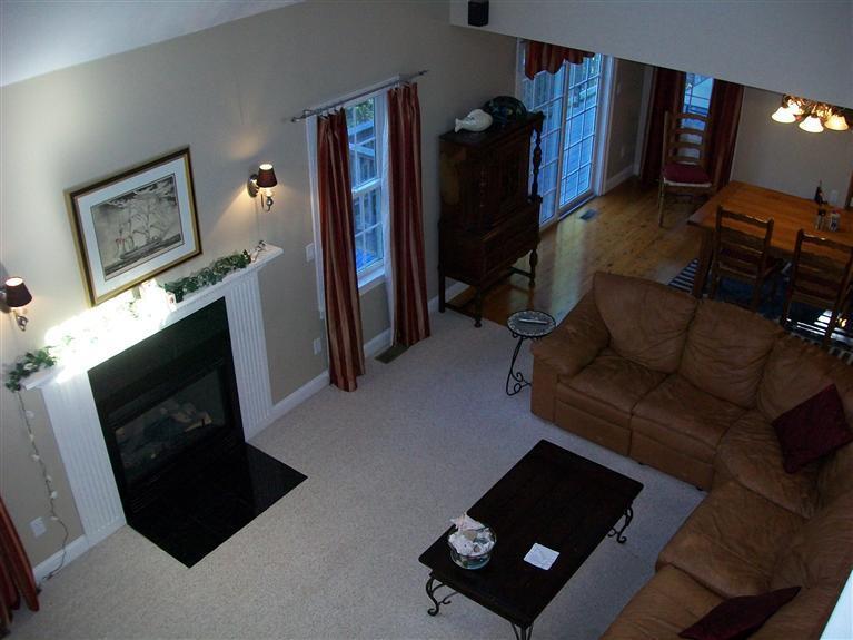71 Meadowbrook Road Mashpee, MA 02649 - Photo 10 of 14 a living room with furniture and a flat screen tv