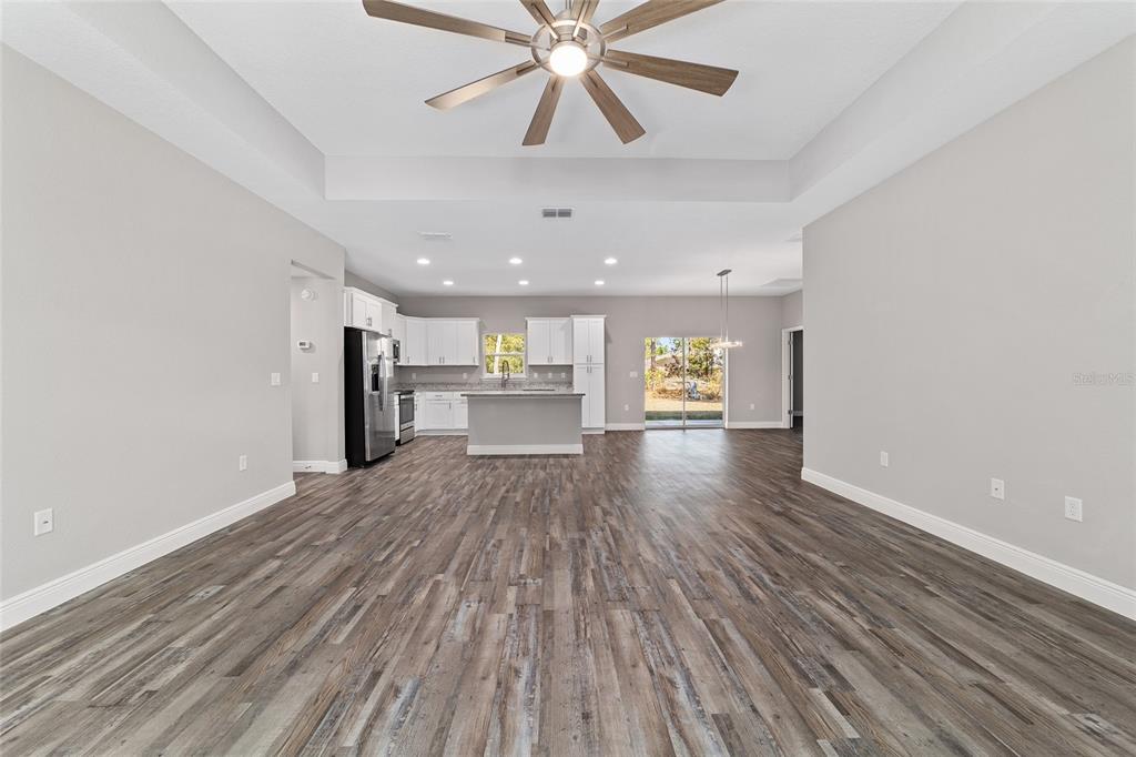 13359 Southwest 80th Street Dunnellon, FL 34432 - Photo 12 of 64 a view of an empty room with a window and wooden floor