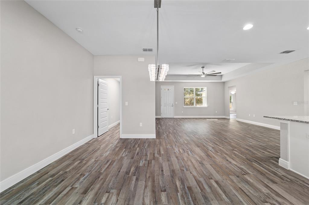 13359 Southwest 80th Street Dunnellon, FL 34432 - Photo 23 of 64 a view of an empty room with window and wooden floor