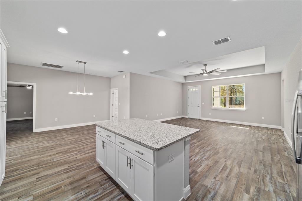 13359 Southwest 80th Street Dunnellon, FL 34432 - Photo 30 of 64 an empty room with wooden floor and windows