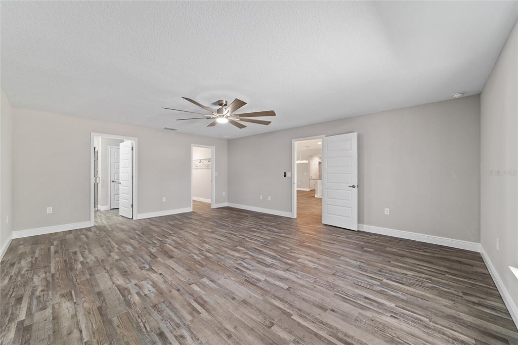 13359 Southwest 80th Street Dunnellon, FL 34432 - Photo 34 of 64 a view of an empty room with wooden floor and window