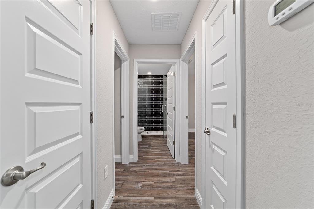 13359 Southwest 80th Street Dunnellon, FL 34432 - Photo 39 of 64 a view of a hallway with wooden floor and staircase