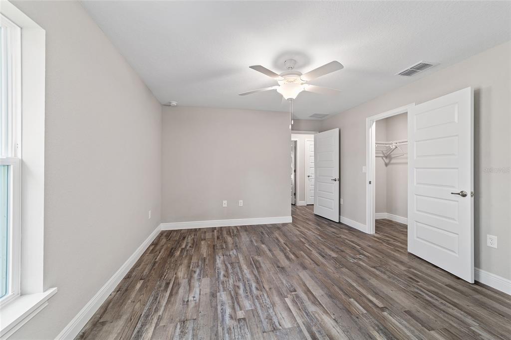 13359 Southwest 80th Street Dunnellon, FL 34432 - Photo 45 of 64 wooden floor in an empty room with a window
