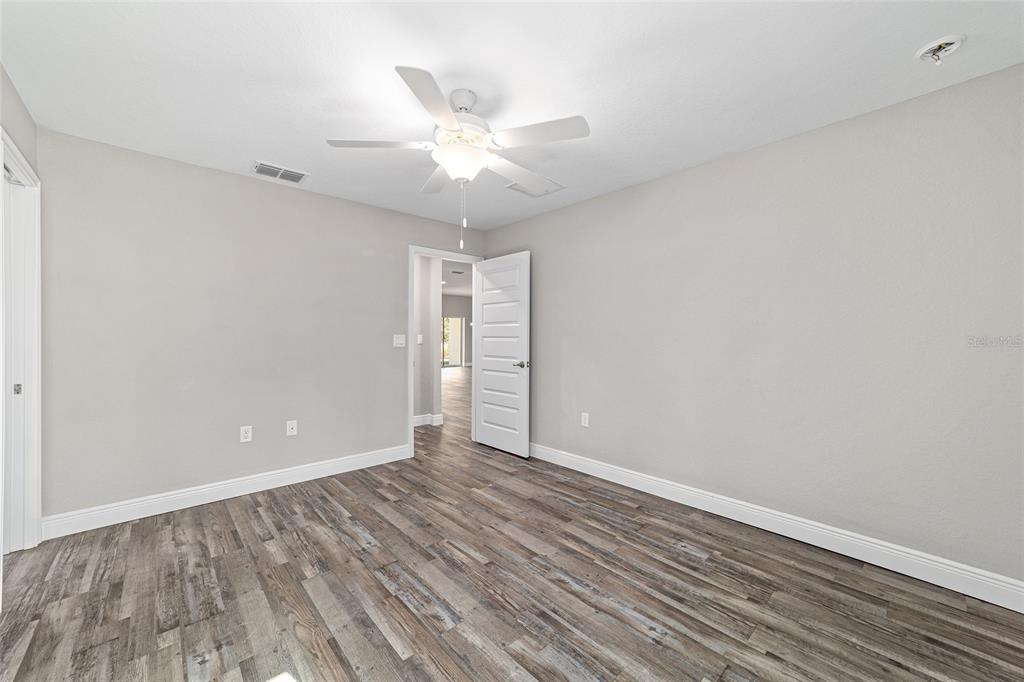 13359 Southwest 80th Street Dunnellon, FL 34432 - Photo 48 of 64 wooden floor in an empty room