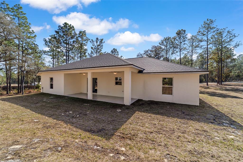 13359 Southwest 80th Street Dunnellon, FL 34432 - Photo 58 of 64 a view of a house with a yard
