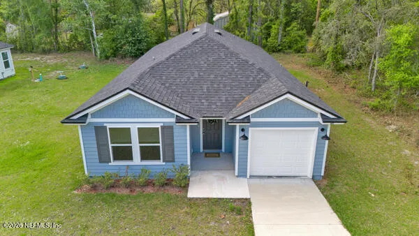 front view of a house with a yard