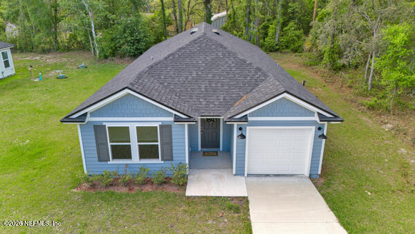 front view of a house with a yard