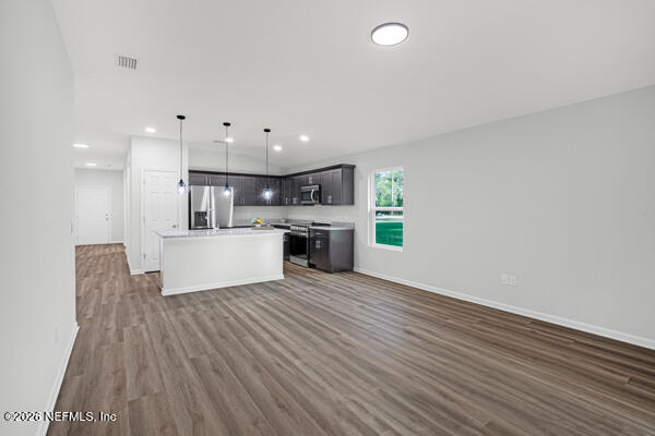 407 Rustic Road Satsuma, FL 32189 - Photo 11 of 55 a view of kitchen with kitchen island wooden floors and stainless steel appliances