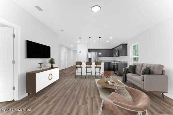 407 Rustic Road Satsuma, FL 32189 - Photo 13 of 55 a living room with furniture and a flat screen tv