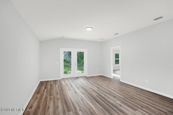 407 Rustic Road Satsuma, FL 32189 - Photo 20 of 55 wooden floor in an empty room with a window