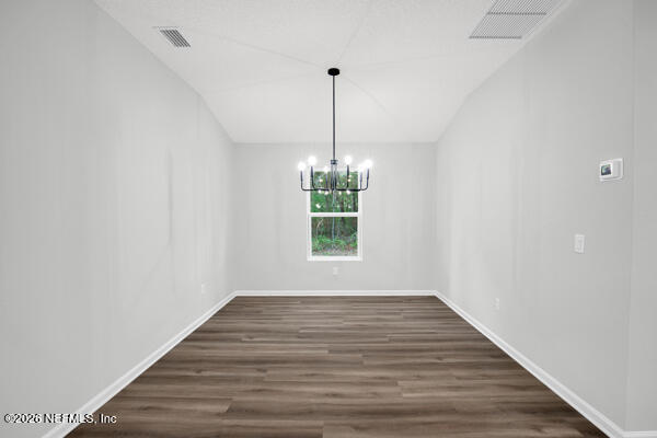 407 Rustic Road Satsuma, FL 32189 - Photo 21 of 55 a view of empty room with window and wooden floor