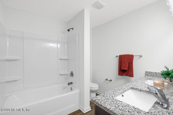 407 Rustic Road Satsuma, FL 32189 - Photo 29 of 55 a bathroom with a granite countertop sink a mirror and bathtub