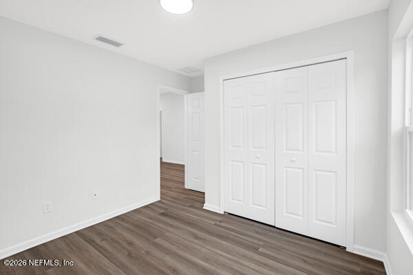 407 Rustic Road Satsuma, FL 32189 - Photo 32 of 55 a view of an empty room with wooden floor