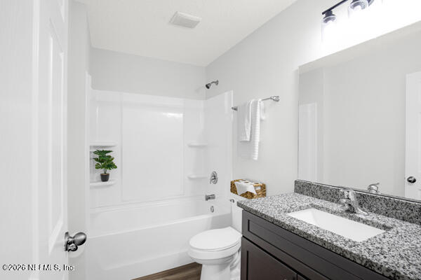 407 Rustic Road Satsuma, FL 32189 - Photo 34 of 55 a bathroom with a granite countertop sink a toilet and shower
