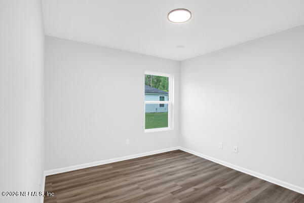 407 Rustic Road Satsuma, FL 32189 - Photo 35 of 55 a view of an empty room with wooden floor and a window