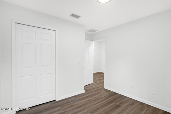 407 Rustic Road Satsuma, FL 32189 - Photo 37 of 55 a view of an empty room with wooden floor