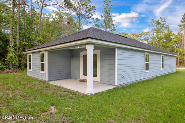407 Rustic Road Satsuma, FL 32189 - Photo 39 of 55 a front view of a house with garden