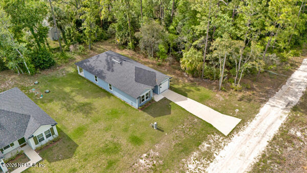 407 Rustic Road Satsuma, FL 32189 - Photo 47 of 55 a view of a yard with chairs