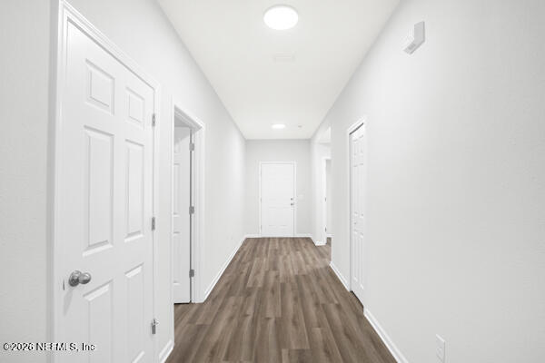 407 Rustic Road Satsuma, FL 32189 - Photo 10 of 55 a view of a hallway with wooden floor and staircase