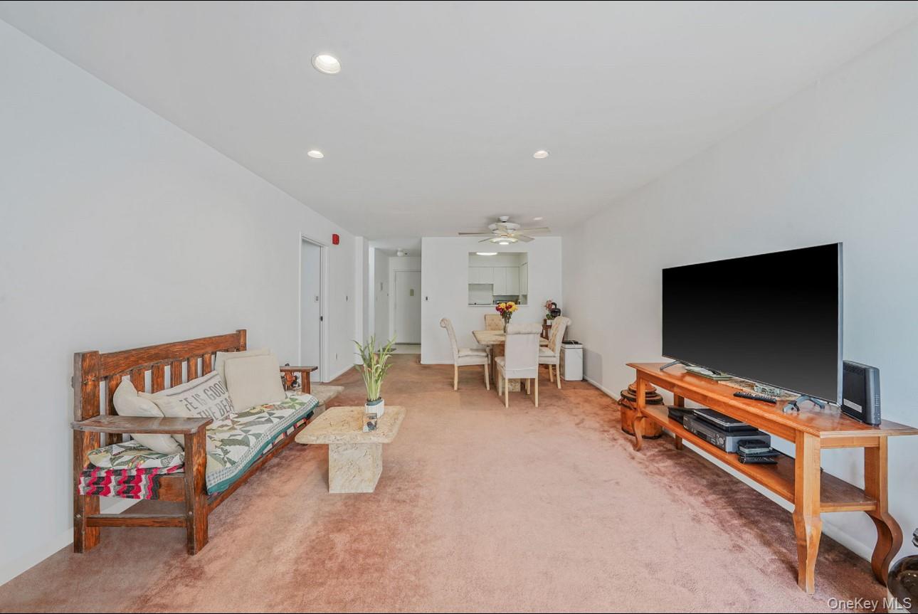 360 Shore Road, Unit 4B Long Beach, NY 11561 - Photo 21 of 28 Carpeted living area featuring recessed lighting and ceiling fan