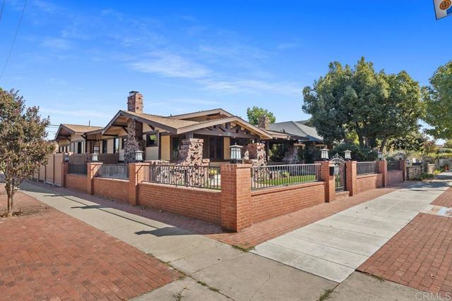 a view of a street with houses on both side