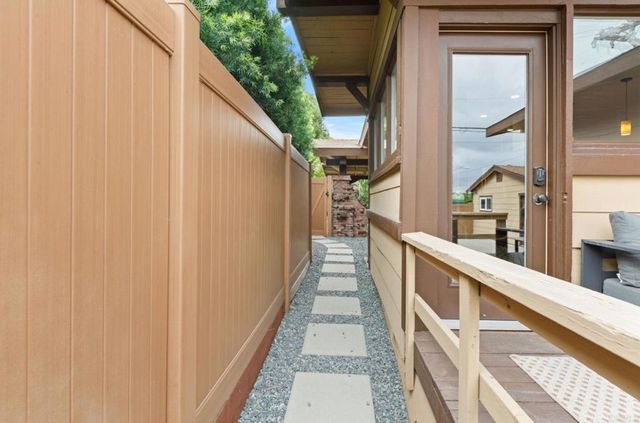a view of balcony with wooden floor and stairs