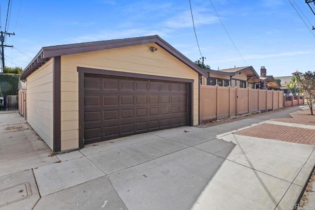 a front view of a house with garage