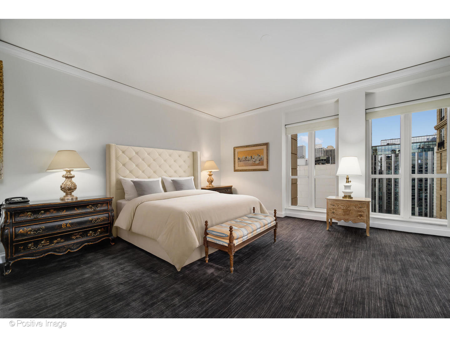 11 East Walton Street, Unit 3201 Chicago, IL 60611 - Photo 21 of 42 a spacious bedroom with a bed and wooden floor