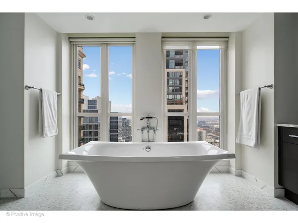 a bathroom with a bathtub and a sink