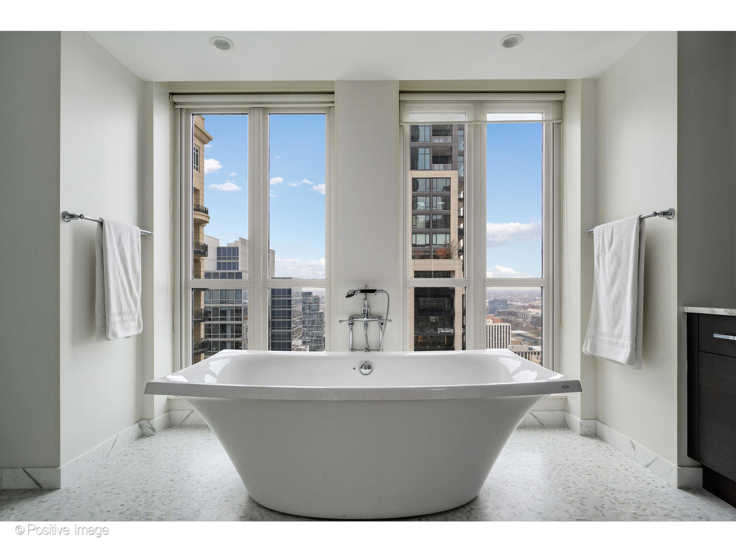 11 East Walton Street, Unit 3201 Chicago, IL 60611 - Photo 24 of 42 a bathroom with a bathtub and a sink