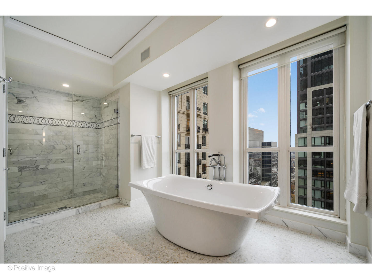 11 East Walton Street, Unit 3201 Chicago, IL 60611 - Photo 25 of 42 a bathroom with a bathtub and shower