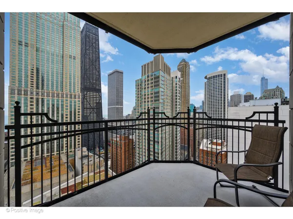 a view of a balcony with furniture