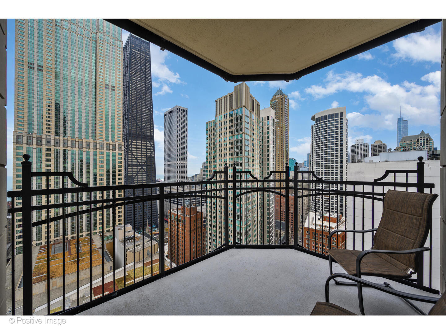 11 East Walton Street, Unit 3201 Chicago, IL 60611 - Photo 30 of 42 a view of a balcony with furniture