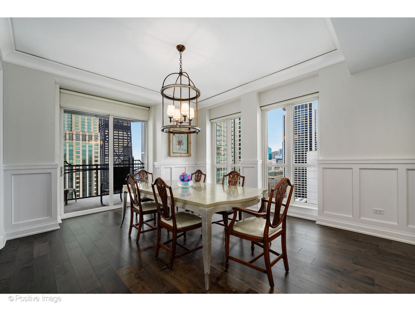 11 East Walton Street, Unit 3201 Chicago, IL 60611 - Photo 6 of 42 a view of a dining room with furniture window and wooden floor