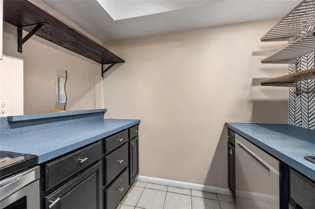 a bathroom with a sink vanity mirror and toilet
