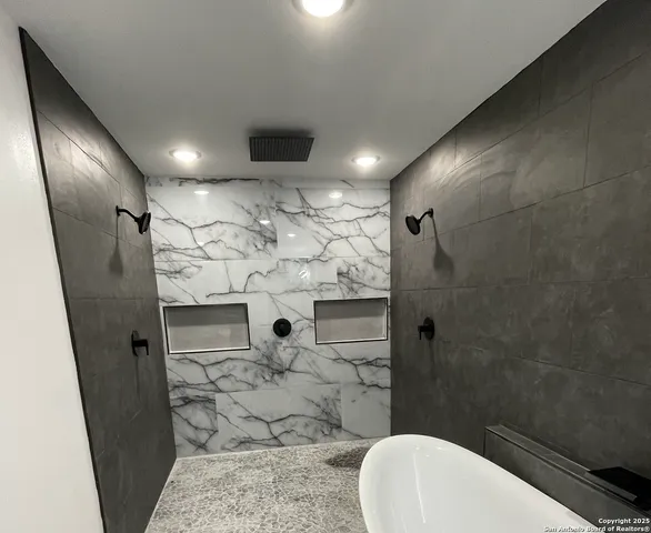 a bathroom with a toilet and shower