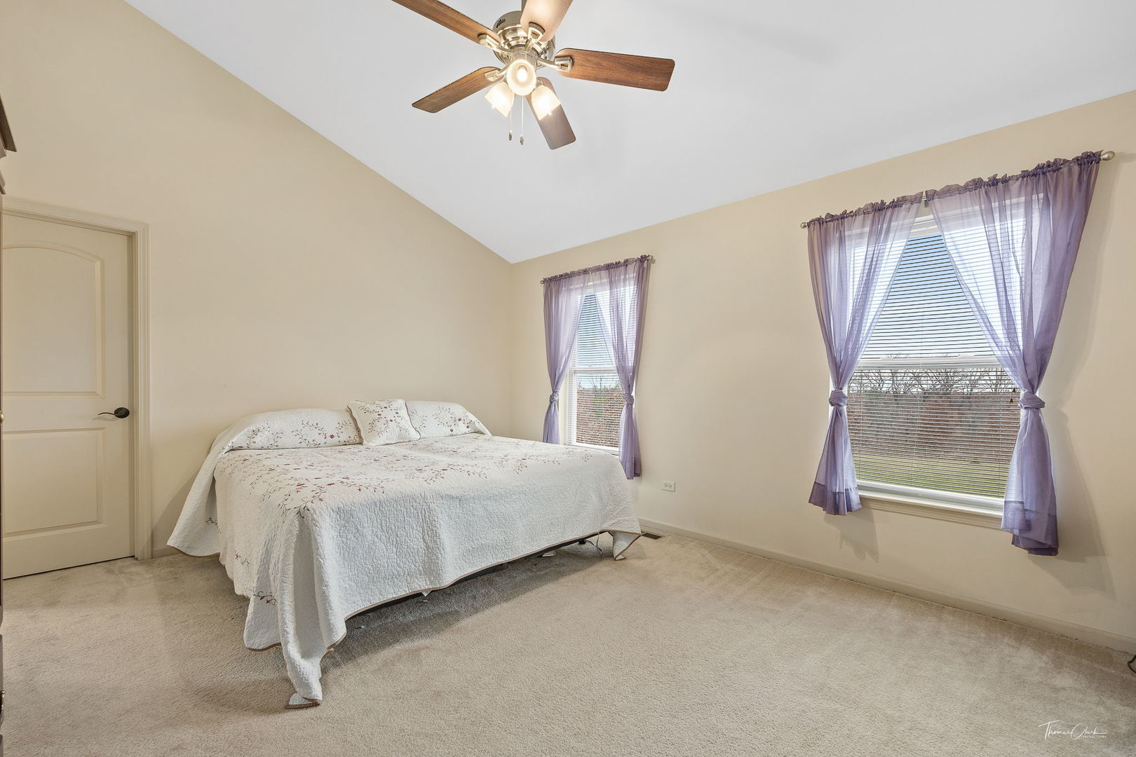8022 West Offner Road Peotone, IL 60468 - Photo 27 of 42 a room with a bed and a chandelier