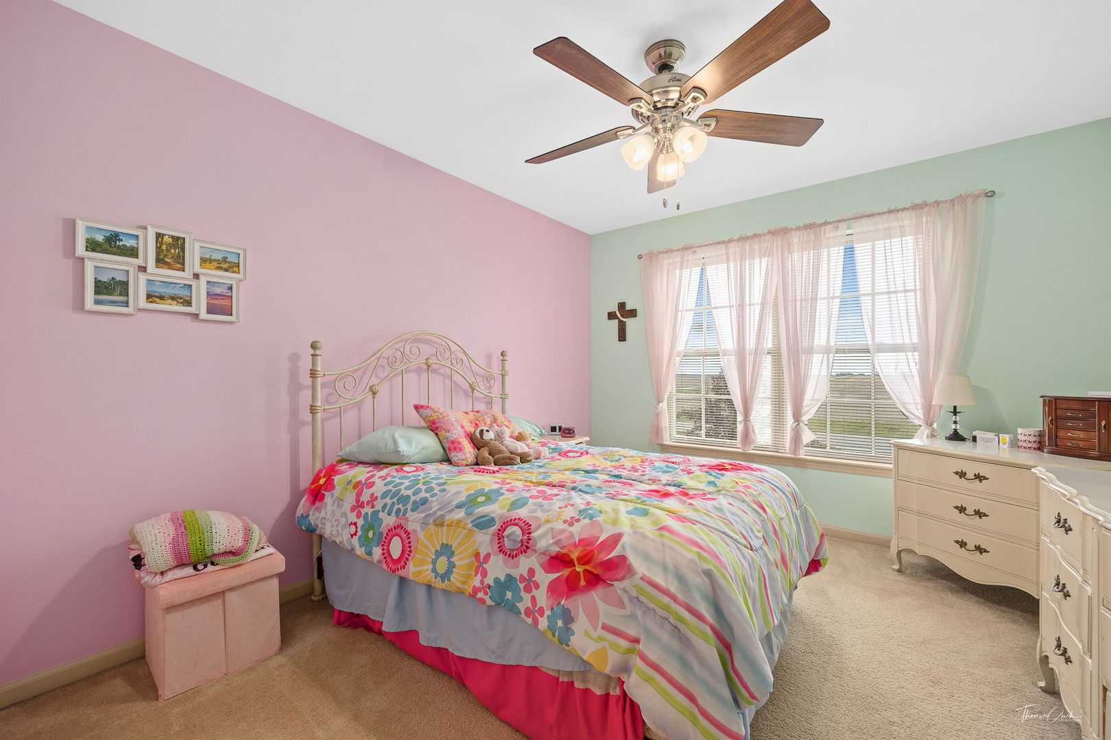 8022 West Offner Road Peotone, IL 60468 - Photo 30 of 42 a bedroom with a bed and a chandelier